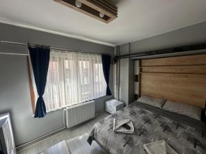 Postel nebo postele na pokoji v ubytování beydağı suit