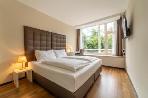 Postel nebo postele na pokoji v ubytování Pakat Residences
