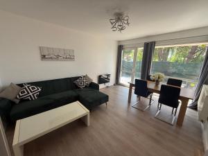 Χώρος καθιστικού στο Superbe appartement spacieux avec parking et jardin privé