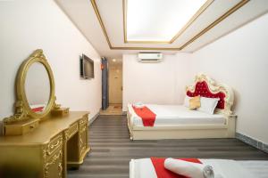 Ένα ή περισσότερα κρεβάτια σε δωμάτιο στο CROWNE BUI VIEN Hotel