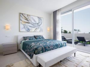 a white bedroom with a bed and a large window at High Luxury Villa Martina, ABAMA in Tejina de Isora +36 photos