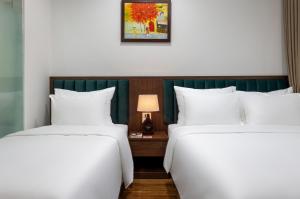 Voodi või voodid majutusasutuse Hanoi Vista Hotel toas