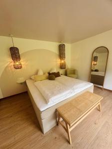 A bed or beds in a room at KWT Lodge