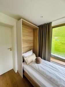 A bed or beds in a room at KWT Lodge