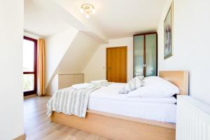Posteľ alebo postele v izbe v ubytovaní Rosa Weneda by Baltic Home