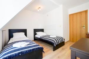 Posteľ alebo postele v izbe v ubytovaní Rosa Weneda by Baltic Home