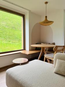 A bed or beds in a room at KWT Lodge