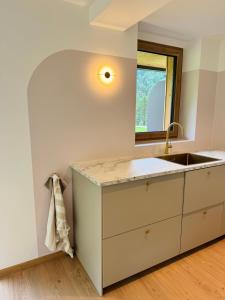 A bed or beds in a room at KWT Lodge