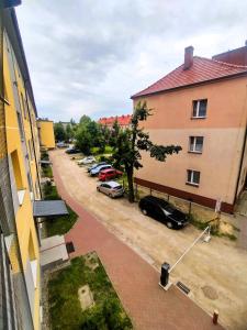 an overhead view of a parking lot with cars parked at Oaza w Centrum - Apartament Tarnowskie Góry in Tarnowskie Góry