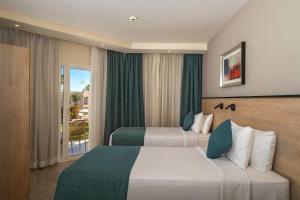 Кровать или кровати в номере Xperience Kiroseiz Parkland +37 фотографий
