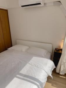 东京塔附近3床公寓にあるベッド