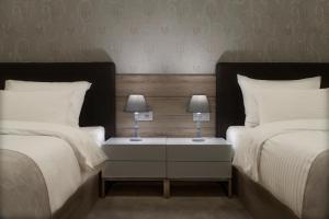 Letto o letti in una camera di IG Hotel