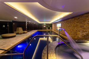 a pool in a hotel room with a swimming pool at Harbour Hotel & Spa Christchurch in Christchurch