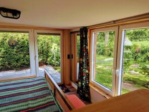a room with two large windows and a rug at Ferienhaus Bornholt in Bornholt