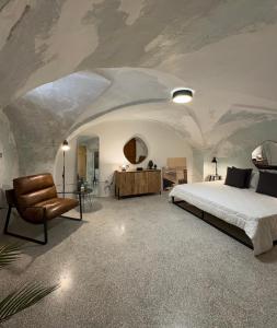 Ένα ή περισσότερα κρεβάτια σε δωμάτιο στο Palazzetto Filippi