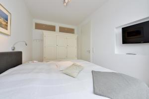 Ein Bett oder Betten in einem Zimmer der Unterkunft Ferienwohnung Silbermöwe