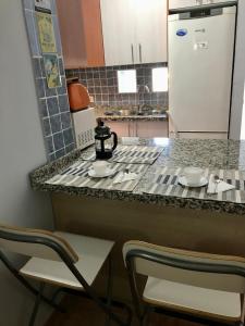 Η κουζίνα ή μικρή κουζίνα στο Apartamentos CAPRIMAR