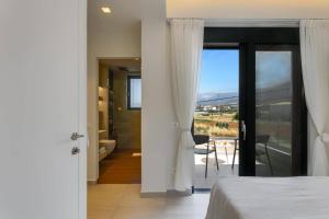 A bed or beds in a room at Villa Mariba Blue by Villa Plus