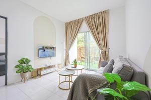 a living room with a couch and a table at Cool Climate Comfort Cameron Highlands Holiday Clover Home 4-27 in Brinchang