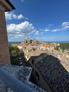 a view of a city from the roofs of buildings at Ostello Fondazione Cardarelli in Ripatransone