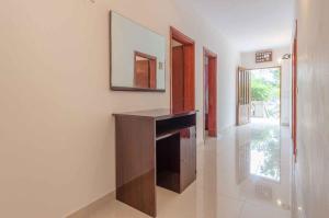 a living room with a desk and a mirror on the wall at Holiday home in Blato Insel Korcula 6411 in Prigradica