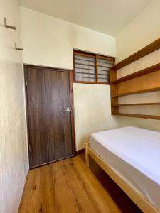 Ένα ή περισσότερα κρεβάτια σε δωμάτιο στο Nomad Hostel Classic