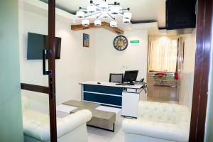 TV a/nebo společenská místnost v ubytování Miugu Village Hotel + 9 fotografií