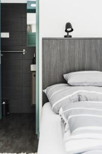 a bedroom with two beds with white pillows at Borovilla in Kismaros