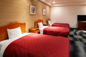 Postel nebo postele na pokoji v ubytování Narita Gateway Hotel