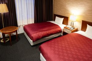 Postel nebo postele na pokoji v ubytování Narita Gateway Hotel