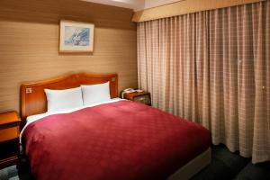 Postel nebo postele na pokoji v ubytování Narita Gateway Hotel