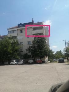a building with a pink frame in front of it at ANAHOME in Gevgelija