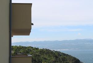 a view of the ocean from a building at Apartmani Marin in Vrbnik