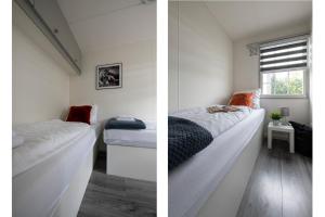 a room with two beds and a window at 32, Woods, Big Garden, Private Parking , AC & Privacy! in Oisterwijk