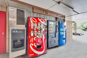 a coca cola vending machine next to a gas station at Studio 6 Extended Stay - Summerville, SC - Charleston in Summerville