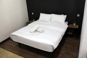 Postel nebo postele na pokoji v ubytování biglife hotel