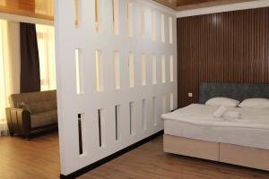 Postel nebo postele na pokoji v ubytování biglife hotel
