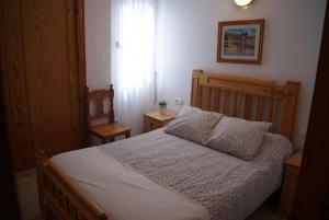 Postel nebo postele na pokoji v ubytování Hostal Sango Sierra de las Nieves
