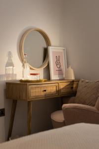 a dressing table with a mirror and a chair at The Wagon Shed in Sowerby Bridge