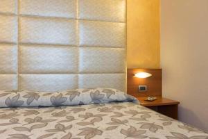 Postel nebo postele na pokoji v ubytování Hotel Doge