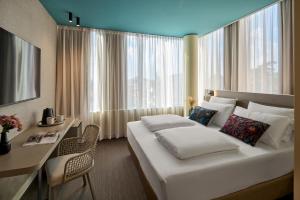 Postel nebo postele na pokoji v ubytování WANDERLUST HOTEL - SUITE & SPA - APARTMENTS & VILLAS - Bardolino, Lago di Garda - Verona