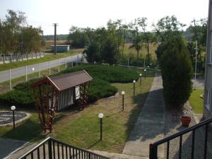 a view of a park with a building and a path at Chrám Ticha in ľubá