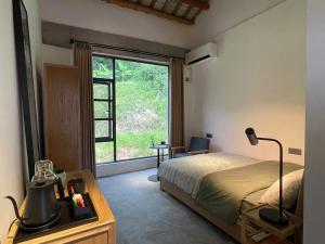 Postel nebo postele na pokoji v ubytování FangYuan Taichi & Qigong Retreat