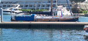 a boat is docked at a dock in the water at Atypique in Le Grau-du-Roi