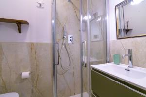 a bathroom with a shower and a sink at Taverna delle Mura in Ameglia +15 photos