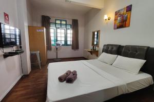 Postel nebo postele na pokoji v ubytování Hotel Check Inn 2