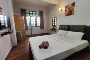 Postel nebo postele na pokoji v ubytování Hotel Check Inn 2