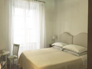 Katil atau katil-katil dalam bilik di Vicolo del Lupo Guesthouse