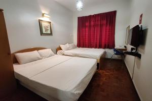 Postel nebo postele na pokoji v ubytování Hotel Check Inn 2