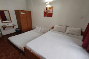 Postel nebo postele na pokoji v ubytování Hotel Check Inn 2